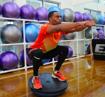 Tyson Gay performing BOSU Squat during Olympic training. 