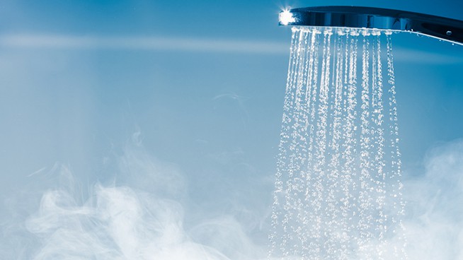 shower with flowing water and steam