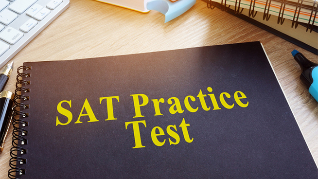 SAT Practice Tests with textbooks on a desk.