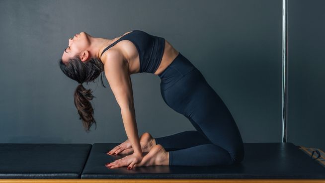 Woman exercizing and bending backwards stretch