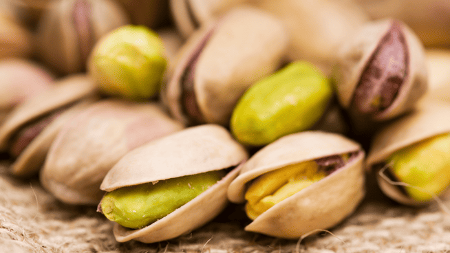 close up image of a bunch of pistachios - are pistachios healthy?