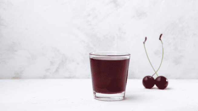 glass of tart cherry juice to help with sports performance and recovery - what is tart cherry?