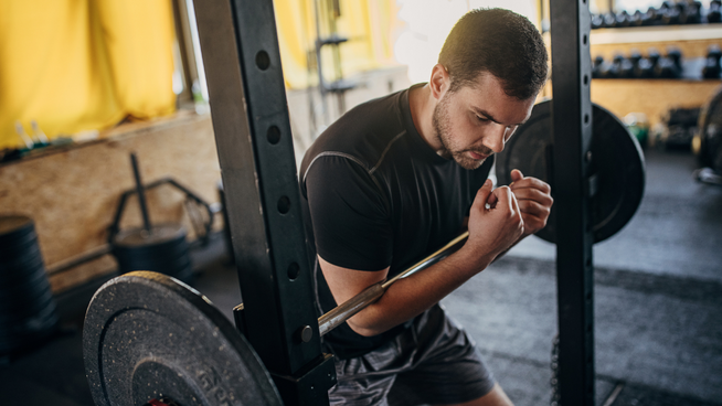 male athlete strength training at the gym