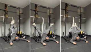 man performing inversion training upside down at gym