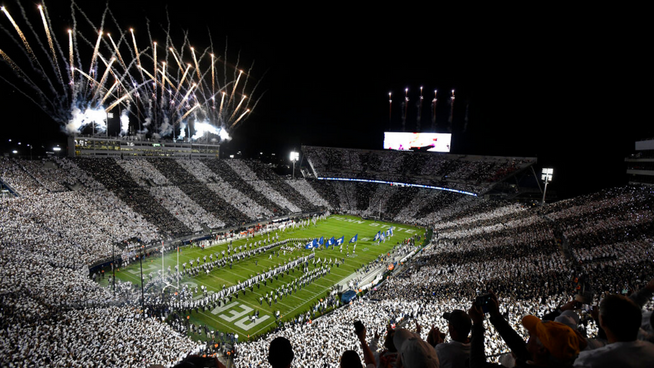 penn state college football stadium with fireworks display and massive crowd