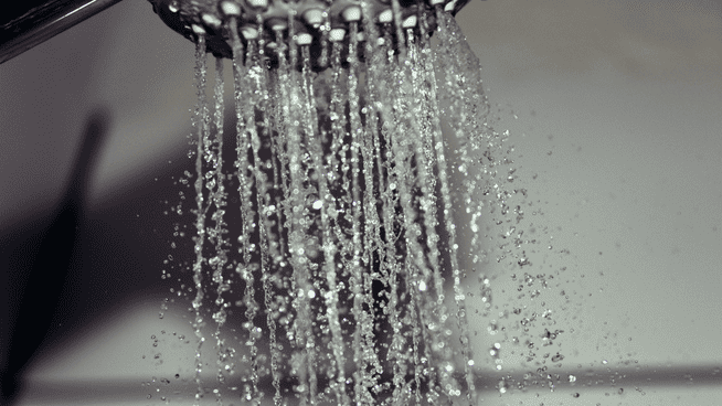 close up image of shower spraying water