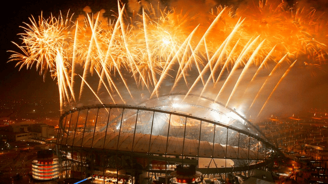 world cup soccer stadium in qatar with lots of fireworks