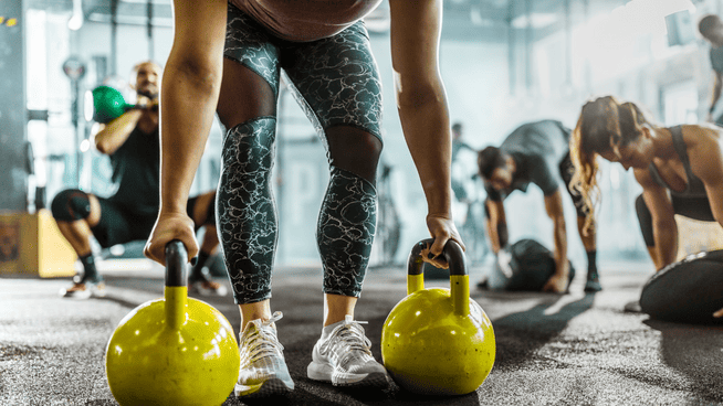 group of people circuit training at the gym