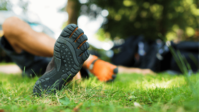 close up image of mans barefoot shoes