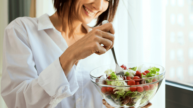 woman eating a healthy salad