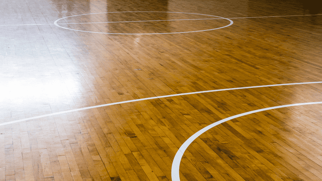 close up image of a basketball court playing surface