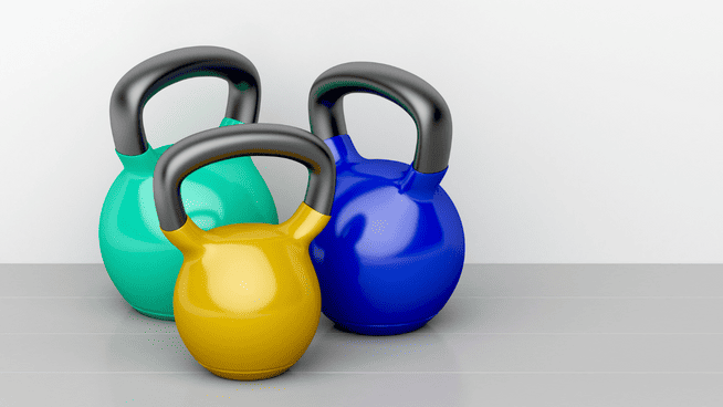 3 different bright colored kettlebells