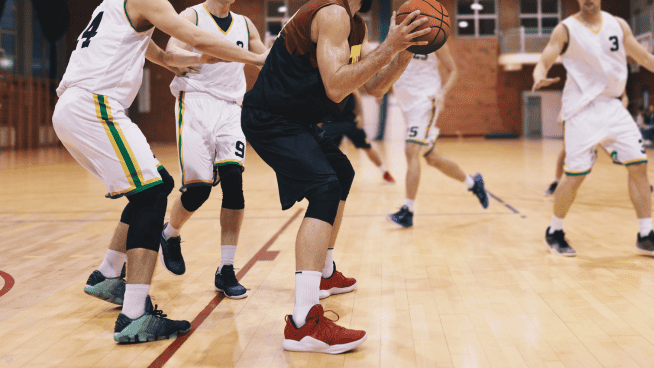 high school basketball teams competing in a gym