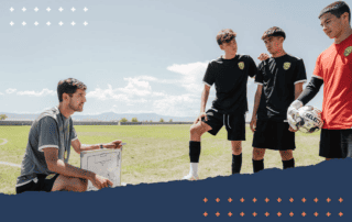 image of soccer coach with clipboard talking to youth soccer athletes