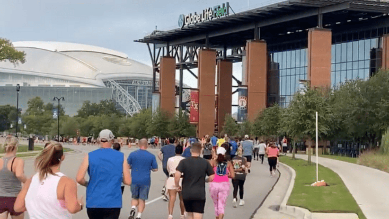 image of runners in front of Globe Life Field and AT&T Stadium in Arlington, TX for the Big Texas Run 5K/10K